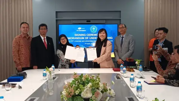 Rektor UMMI, Dr. Reny Sukmawany, M.P. dan Presiden FPT University, Dr. Le Truong Tung menunjukkan MoU kolaborasi di bidang riset dan pendidikan. (Sumber Foto: Dok. UMMI)