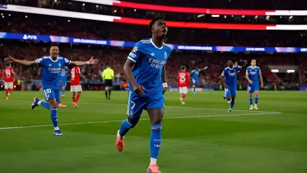 Selebrasi Vinicius Jr setelah mencetak gol untuk Real Madrid saat lawan Benfica (Sumber: web/realmadrid.com)